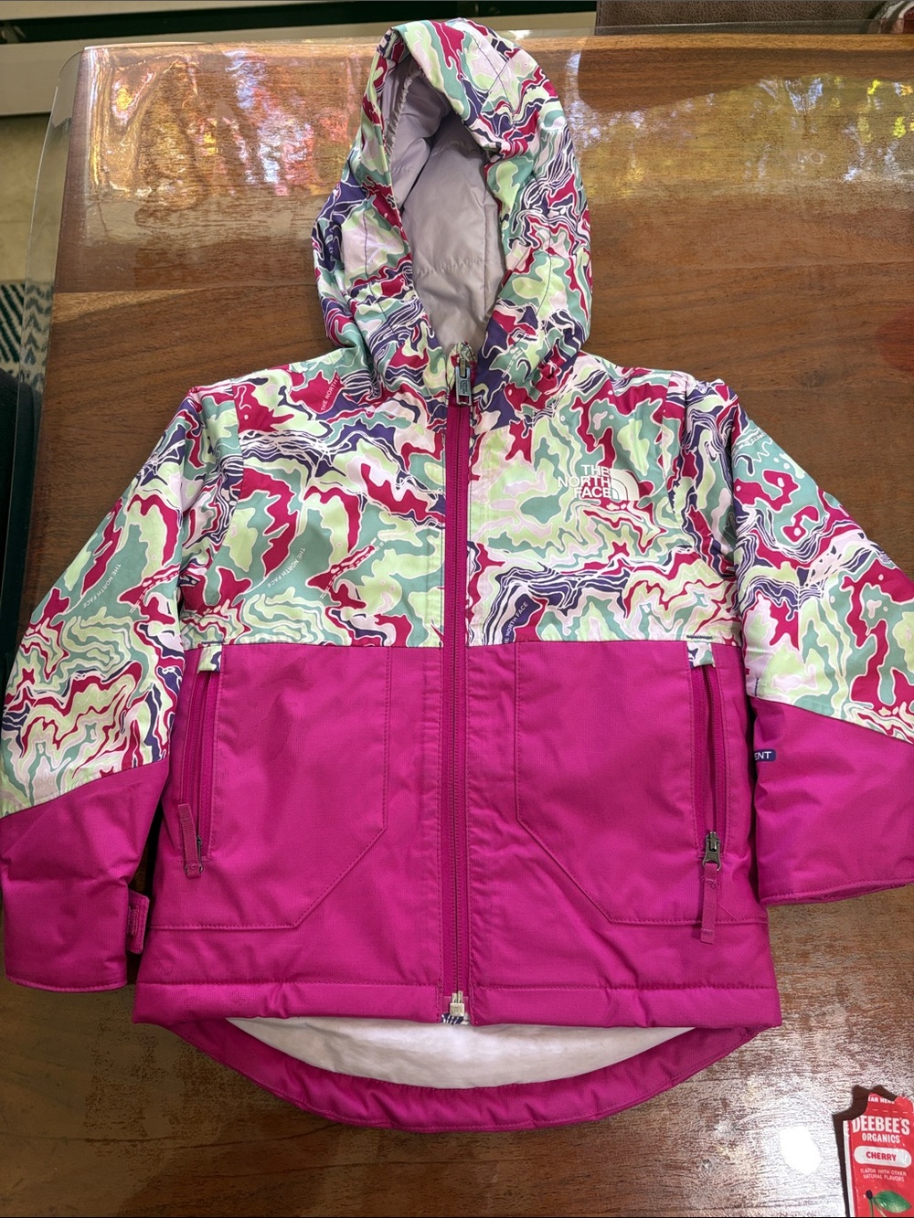 The North Face Girls' Magenta Hooded Winter Jacket with Multicolor Swirl Print